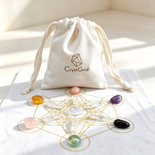 CrystGrid linen pouch behind a black gold Metatron grid cloth with chakra stones and quartz points