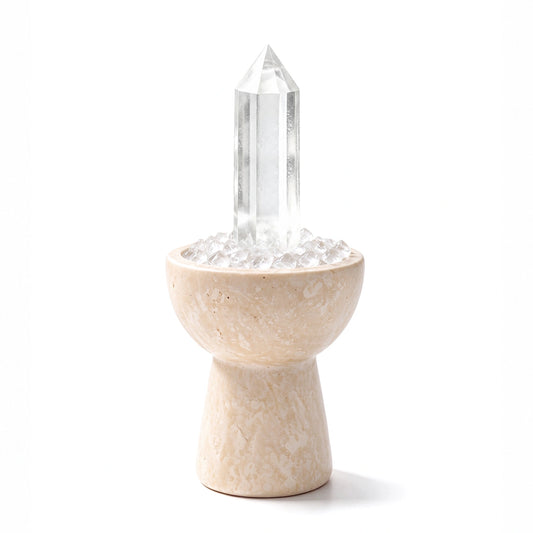 White crystal chalice arranged in a travertine vessel with natural crystal pieces