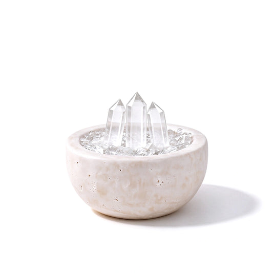 Clear Array Treasure Basin crystal vessel in a natural stone basin with crystal points
