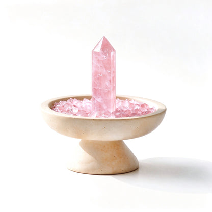 Rose crystal focus plinth vessel with natural crystal pieces on a travertine base