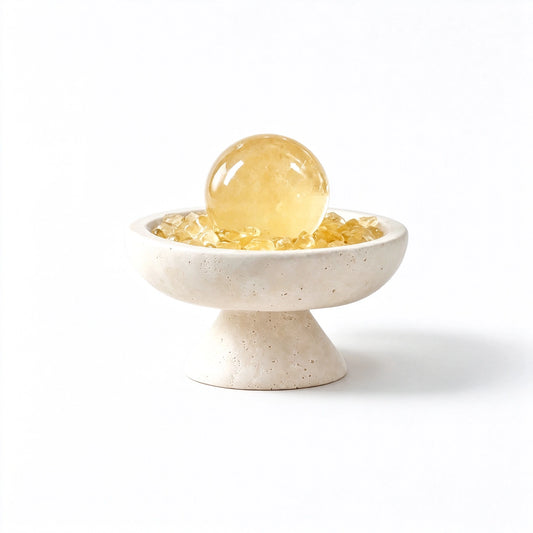 Citrine crystal radiance plinth vessel with natural crystal pieces on a travertine base