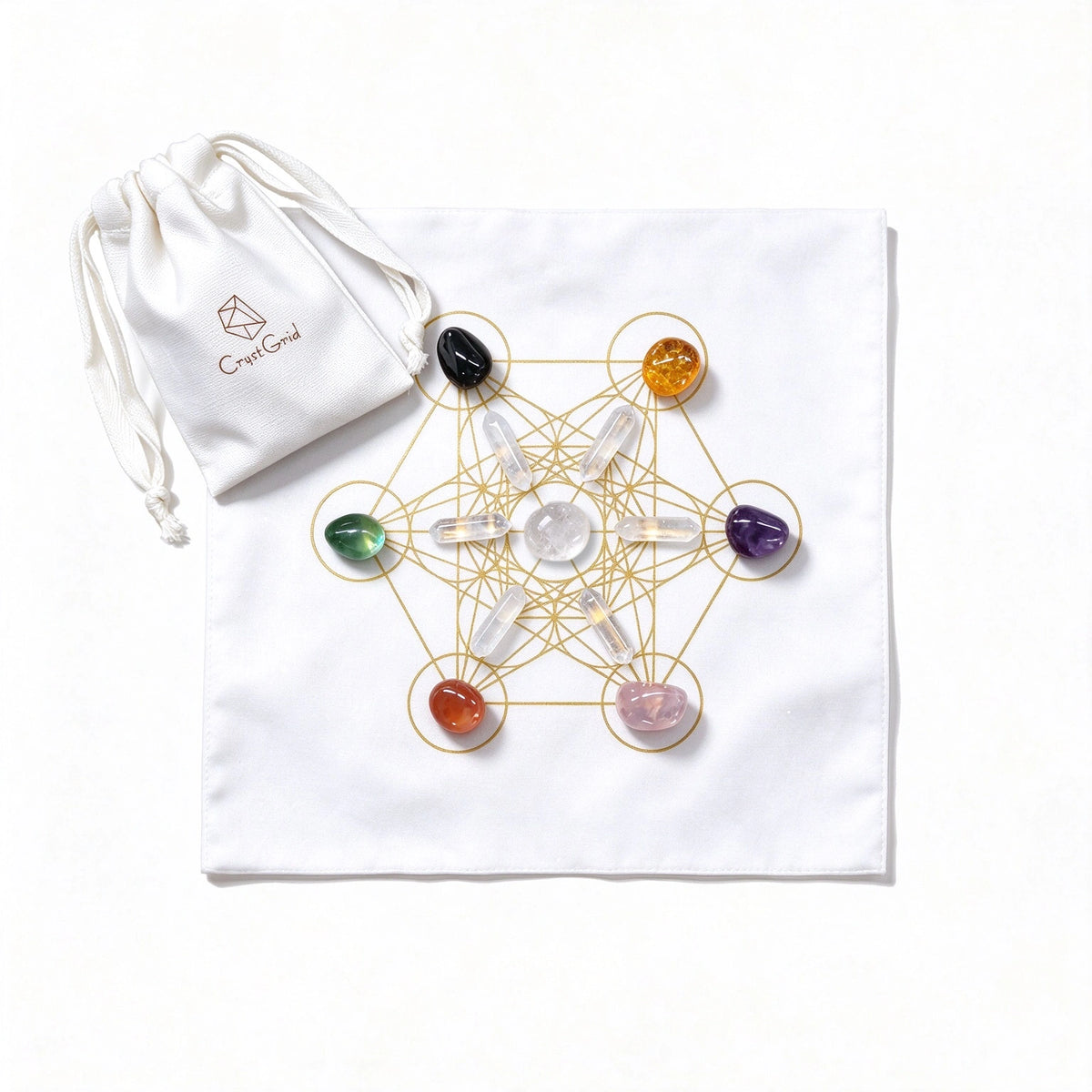 Seven chakra stones and six clear quartz points on a black gold Metatron grid cloth, CrystGrid pouch beside