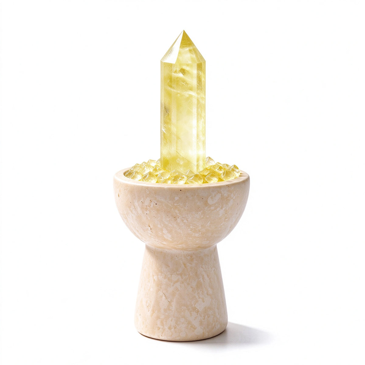 Citrine crystal chalice arranged in a travertine vessel with natural crystal pieces