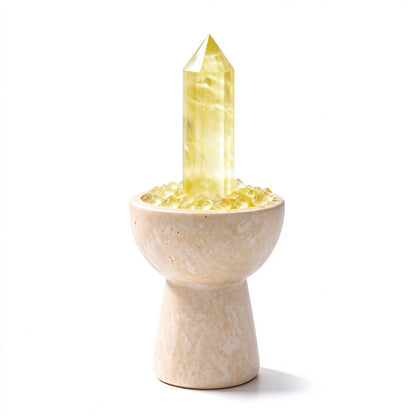 Citrine crystal chalice arranged in a travertine vessel with natural crystal pieces