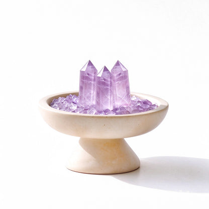 Amethyst crystal array plinth vessel with natural crystal pieces on a travertine base