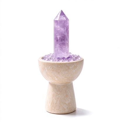Amethyst crystal chalice arranged in a travertine vessel with natural crystal pieces