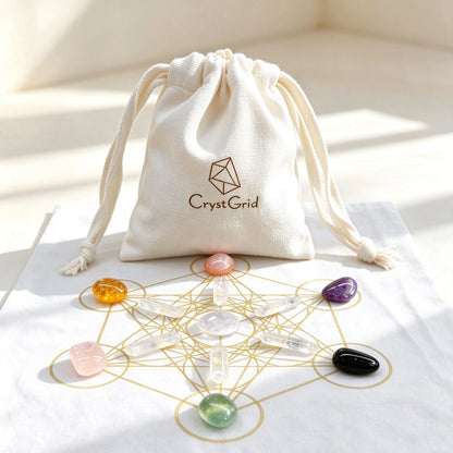 CrystGrid linen pouch behind a black gold Metatron grid cloth with chakra stones and quartz points