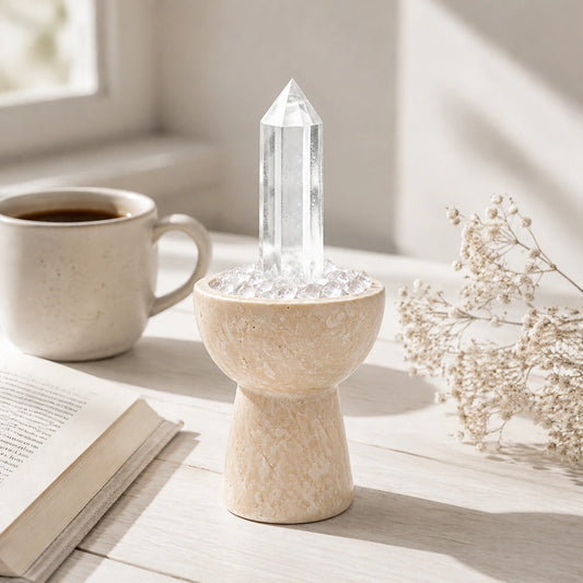 Close-up of the white crystal chalice with natural stones and travertine details