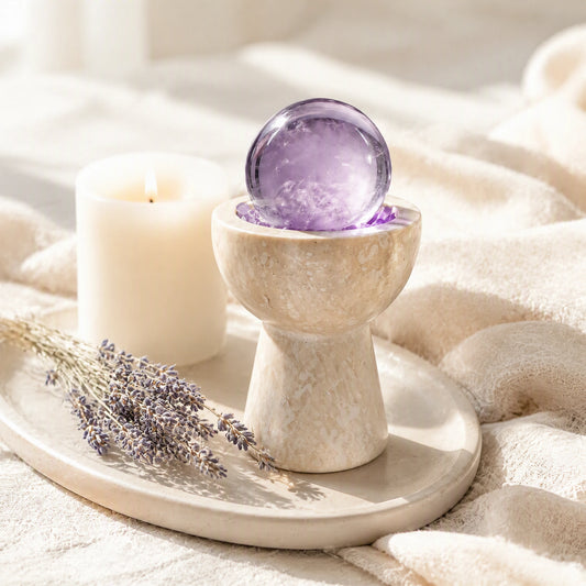 Close-up of the amethyst crystal sphere chalice with natural stones and travertine details