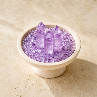 Overhead view of amethyst crystals arranged in the array vessel with loose crystal stones