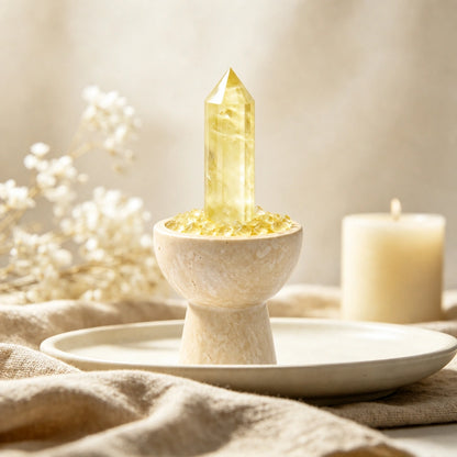 Overhead view of citrine crystals and loose crystal stones arranged in the vessel