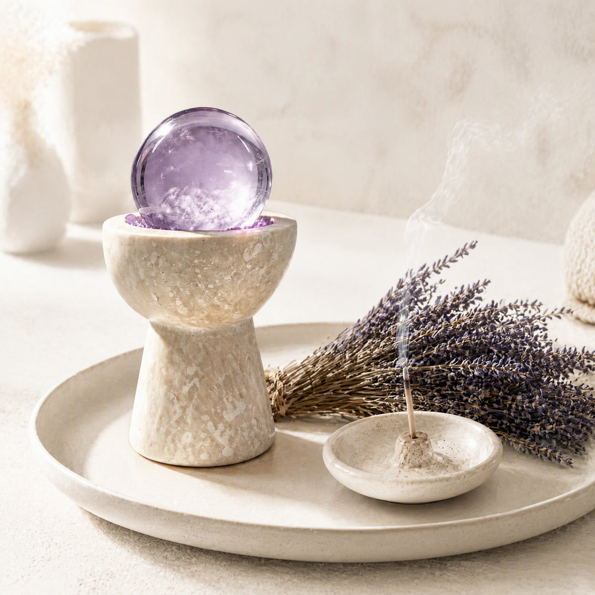 Overhead view of amethyst crystals and loose crystal stones arranged in the vessel