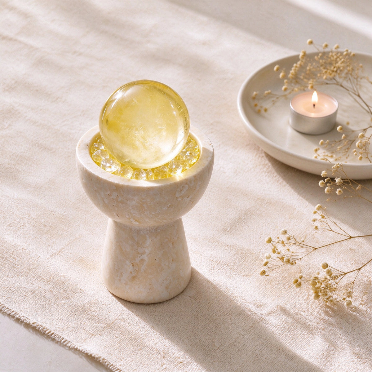 Citrine crystal altar decor with a travertine sphere chalice vessel