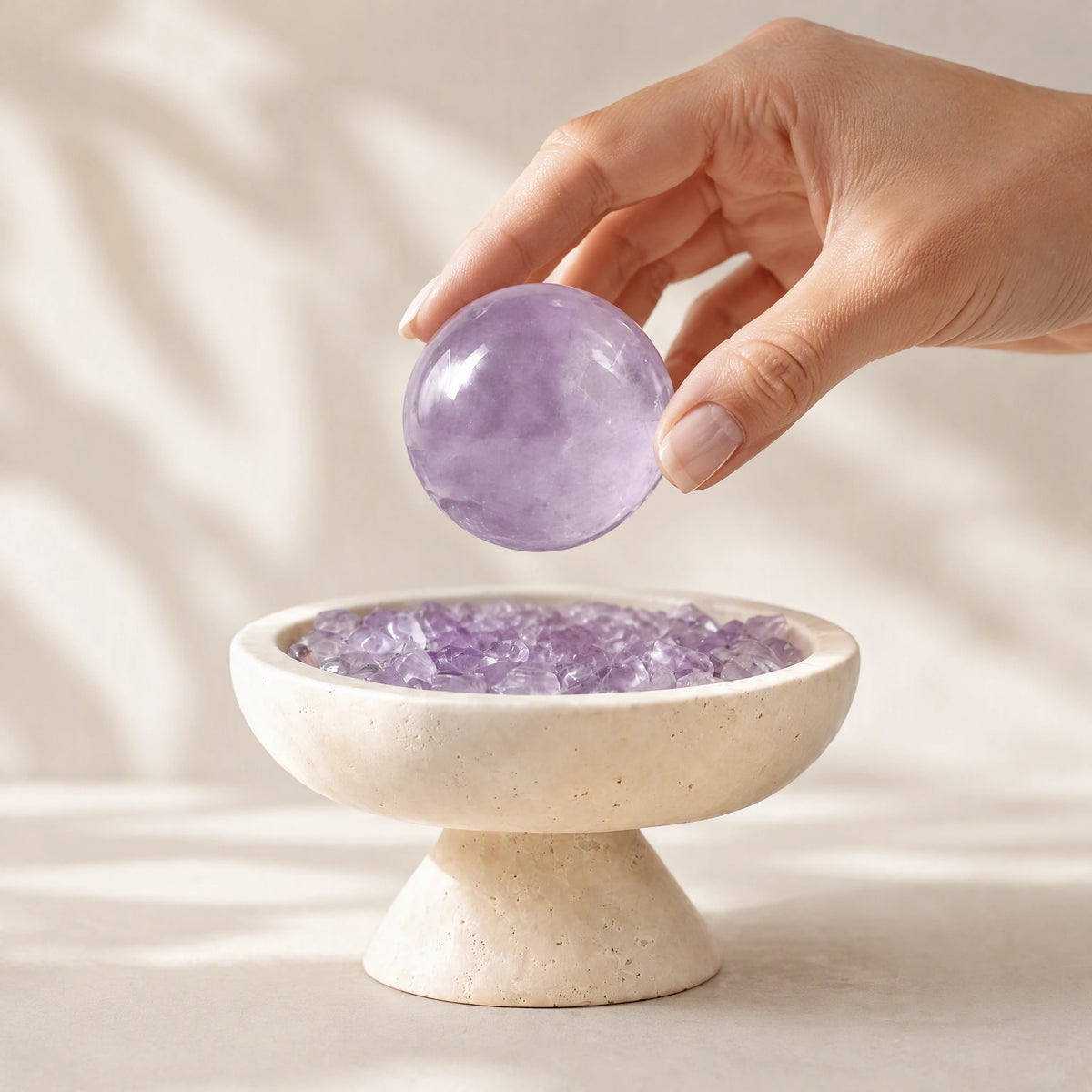 Amethyst crystal altar decor with a travertine sphere vessel